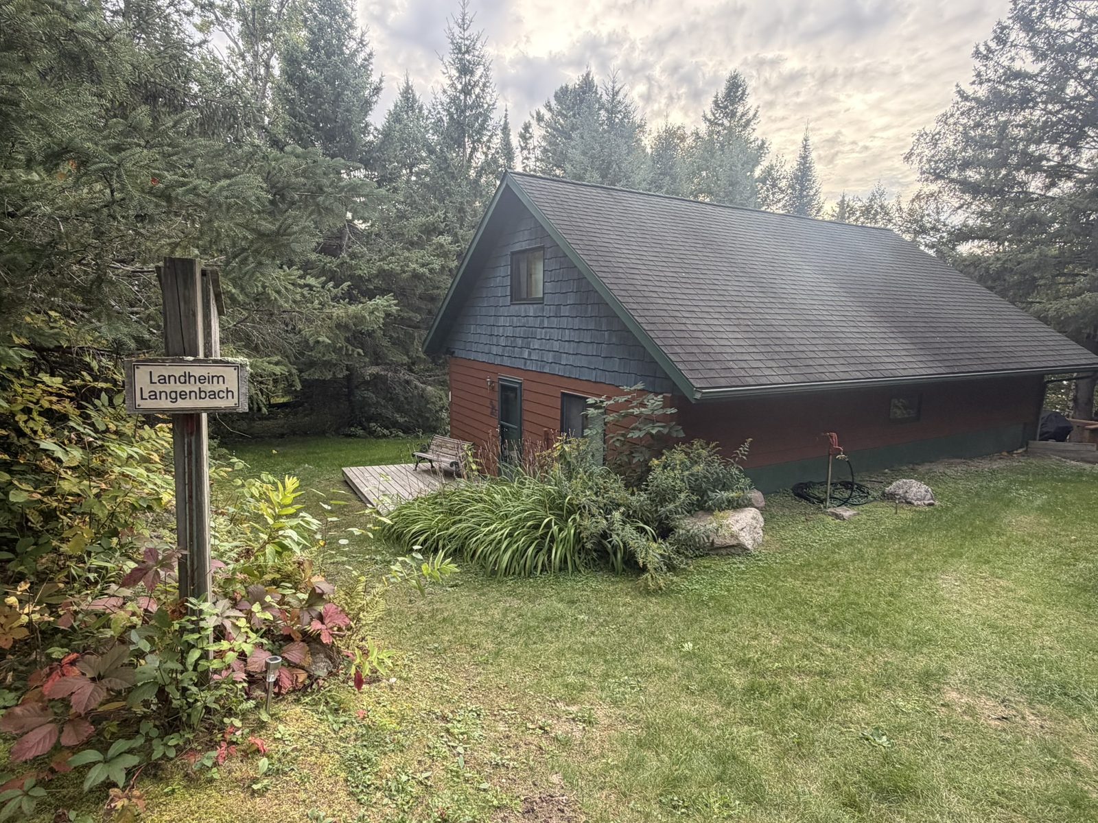 The Loon House and its vintage cabin sign